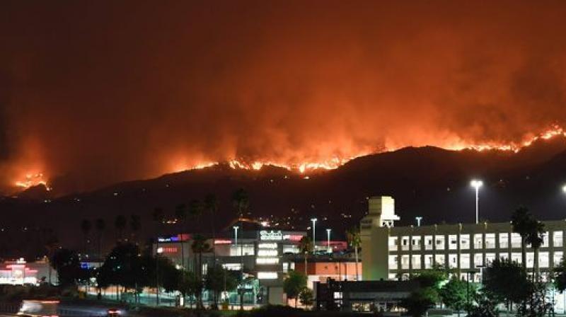 Authorities are staying cautious in the face of blazes that have now killed at least 40 people and destroyed at least 5,700 homes. (Photo: AFP)