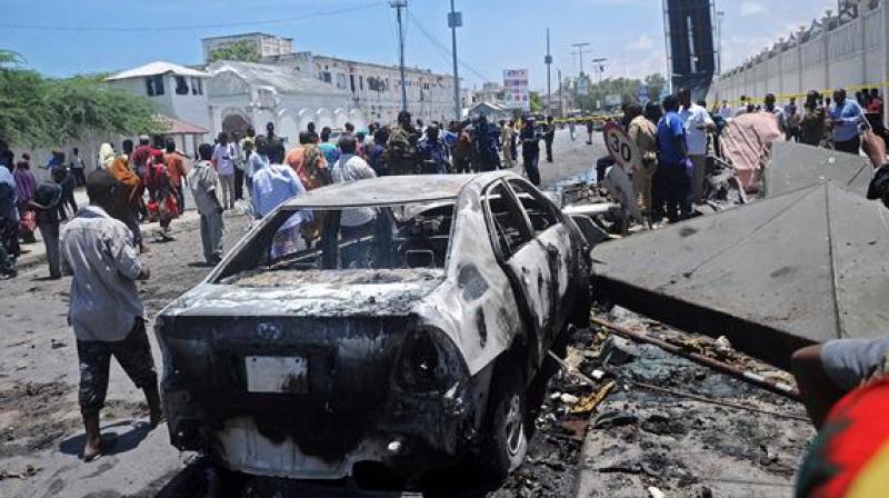 Police said a truck bomb exploded outside a hotel in the K5 intersection that is lined with government offices, restaurants and kiosks, flattening several buildings and setting dozens of vehicles on fire. (Photo: AFP)