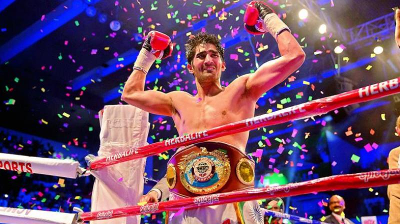 Till date, Vijender has a record of seven out of seven wins with six knockouts in 27 rounds. (Photo: AFP)