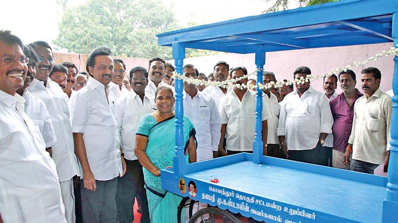 Opposition Leader M.K. Stalin distributes welfare assistance to the public at his Kolathur  constituency on Thursday. (Photo: DC)