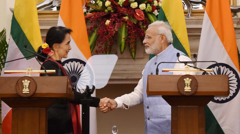 Prime Minister Narendra Modi shakes hands with Myanmar State Counsellor and Foreign Minister Aung San Suu Kyi after their joint press statement at Hyderabad House, in New Delhi. (Photo: PTI)