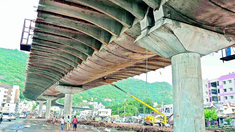 Kanakadurga flyover construction work in progress at I-Town in Vijayawada on Friday.  (Deccan chronicle)