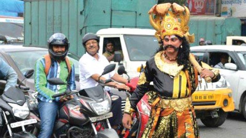 Lord Yamraj awaits the  helmetless in this new campaign by the city traffic police.