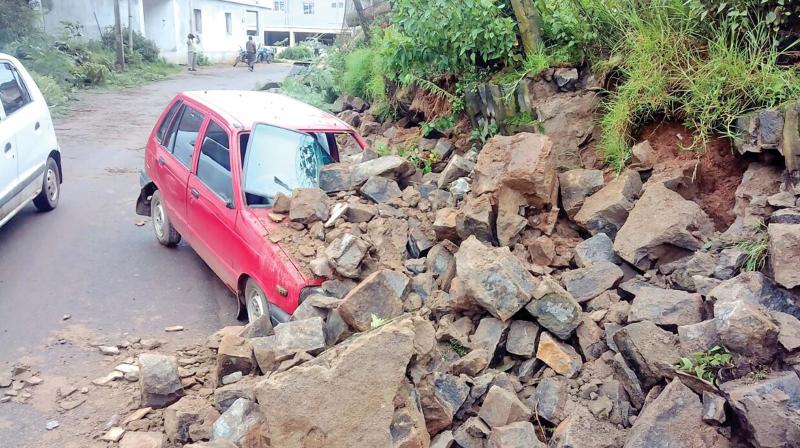 Landslip at Woodcock road in St.Marys hill area in Ooty damages vehicles along the road side.(Photo: DC)