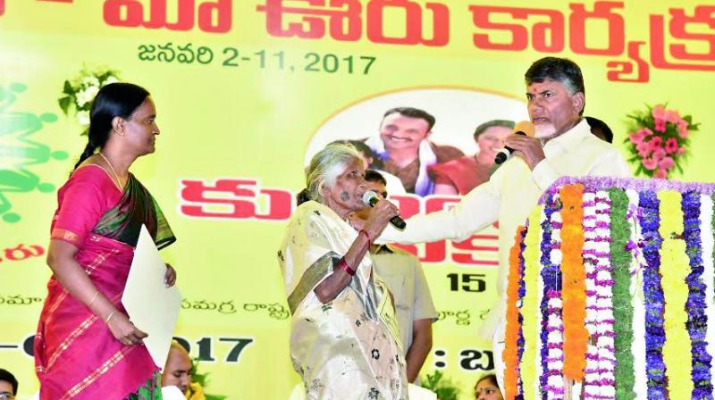 Chief Minister N. Chandrababu Naidu interacts with an elderly woman at Janmaboomi  programme at Bukkapatnam in Anantapur district on Wednesday.	 DC