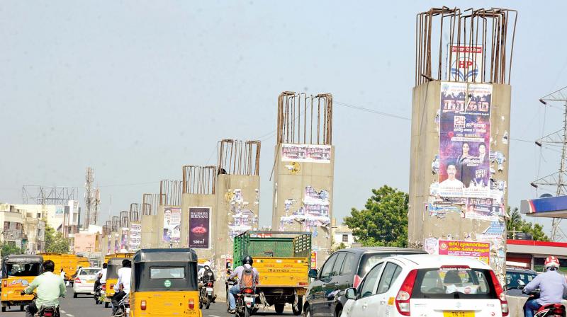 Work at port-Maduravoyal elevated expressway remains incomplete  causing inconvenience to vehicles and pedestrians alike. (Photo:DC)