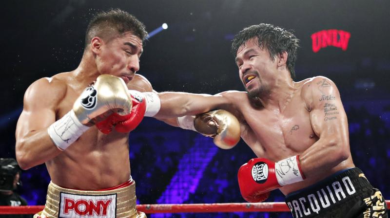 Pacquiao won on all three ringside scorecards  118-109, 118-109 114-113  to take the piece of the title Vargas won in his last fight. (Photo: AP)