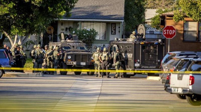 Police say a female armed with an assault rifle, but there are conflicting reports. (Photo: Los Angeles Times)