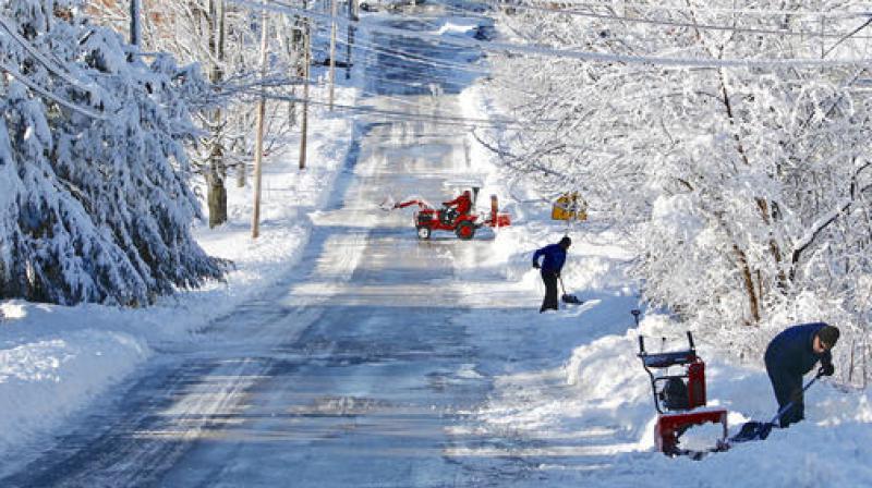 Residents clear snow from their driveways in South Berwick, Maine. (Photo: AP)