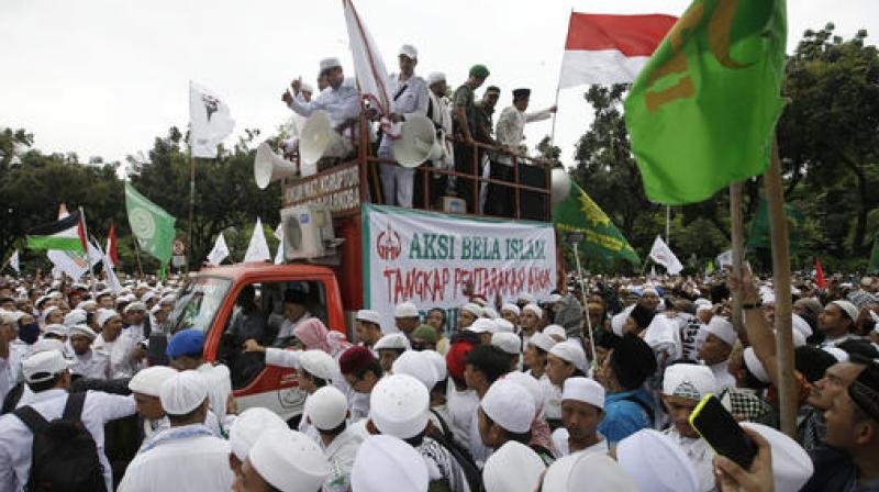 Demonstrators gathered at Istiqlal Mosque and nearby locations for the protest expected to begin in the early afternoon following Friday prayers. (Photo: AP)