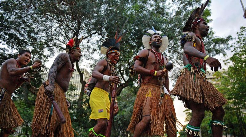 Brazils indigenous people perform ritual dance during protest against land threats