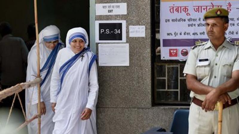 Nuns exiting a polling booth after casting their votes in the Delhi municipal polls on Sunday. (Photo: PTI/Manvender Vashist)