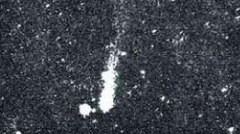 A photograph of a Comet taken on February 21, 1941 from the Nizamiah observatory in Hyderabad.