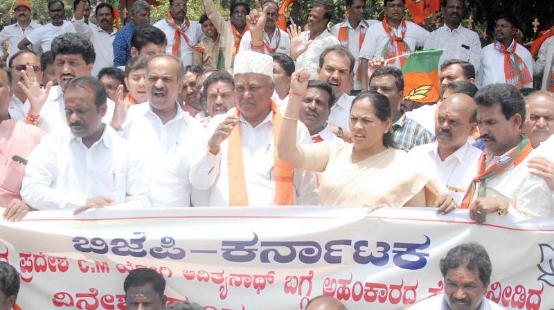 BJP members protest against KPCC working president Dinesh Gunduraos remarks against UP Chief Minister Yogi Adityanath, in Bengaluru on Sunday  (Image: KPN)