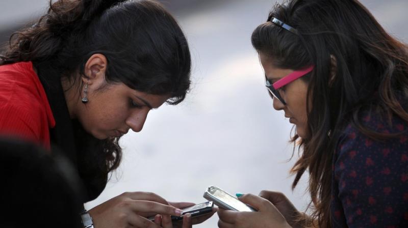 Electronic media are becoming a larger part of teens lives and are often used before bed (Photo: AP)