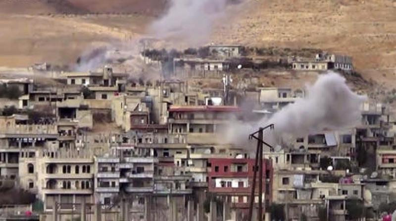 Smoke rises from the government forces shelling on Wadi Barada, northwest of Damascus, Syria. (Photo: AP)