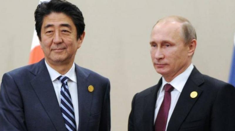 Japan Prime Minister Shinzo Abe and Vladmir Putin
