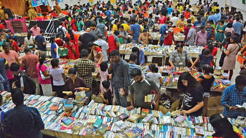 Huge crowds thronged the Bookchor exhibition at T Nagar Vijaya Mahal on Sunday. (Left) Alok Raj Sharma, one of the co founders, with the three boxes. (Photo: DC)