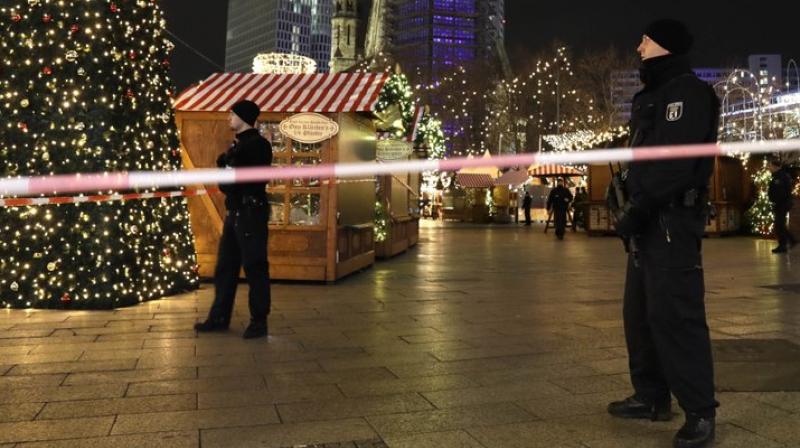 Berlin police arrest suspected driver of truck that rammed into Christmas market, killing at least 9.