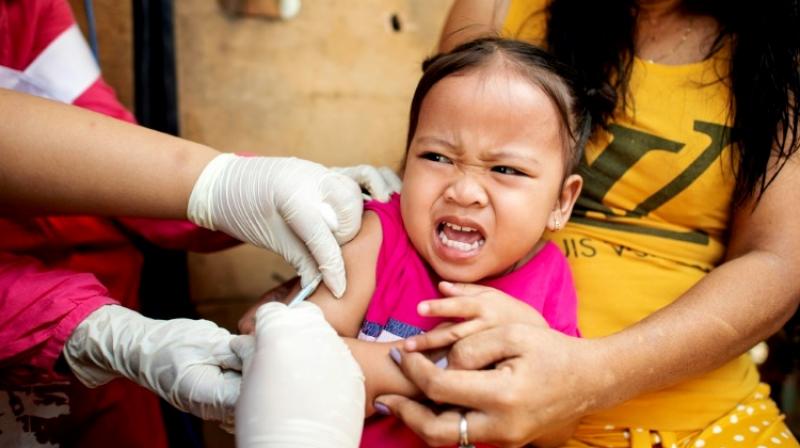 A child reacts during a Philippine Read Cross Measles Outbreak Vaccination Response in Manila on February 16, 2019. (Photo: AFP)