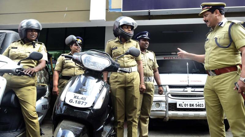 The new Kochi city police commissioner S. Surendran gives instructions to women police officials during a surprise visit to the Central station after taking charge. As part of the International Womens Day celebration, women personnel manned the Central station today.  (ARUN CHANDRABOSE)