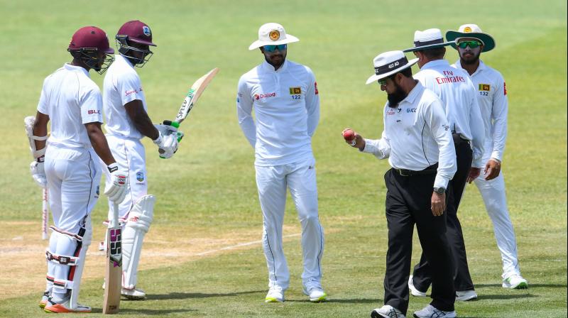 Play only resumed after a two-hour delay when the Sri Lankans, led by captain Dinesh Chandimal, had refused to take the field following a decision by umpires Aleem Dar and Ian Gould to charge the tourists with altering the state of the ball during the latter stages of the second days play. (Photo: AFP)