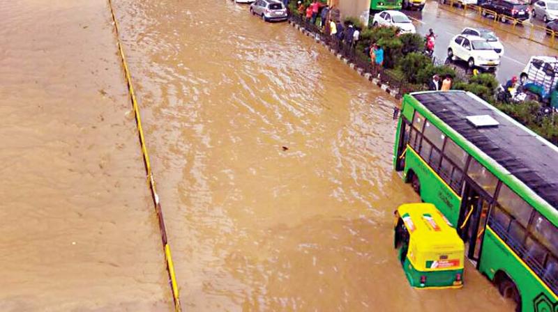 Hosur Road is flooded after heavy rain in Bengaluru on Thursday. (Photo: DC)