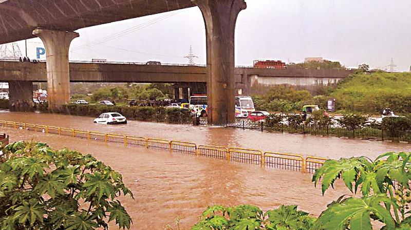 A view of the flooded Electronics City road in Bengaluru. (Photo: DC)