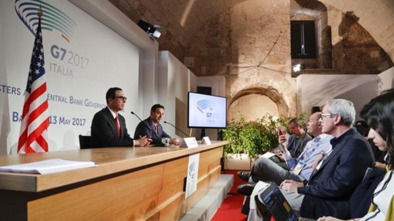 United States Treasury Secretary Steven Mnuchin, left, gives a press conference on the last day of a three-day summit of G7 of finance ministers, in Bari, southern Italy. (Photo: AP)