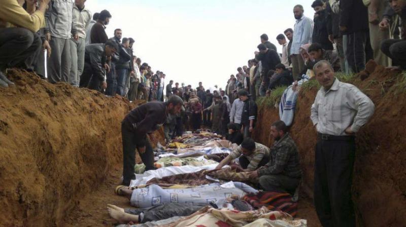 A mass burial of people allegedly killed in Syria in April 2017. (Photo: AP)