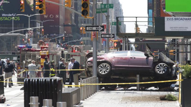 A three-foot-tall piece of stainless steel in the ground ultimately stopped a speeding Honda Accord as it barreled down the crowded sidewalks of Times Square this week. (Photo: AP)