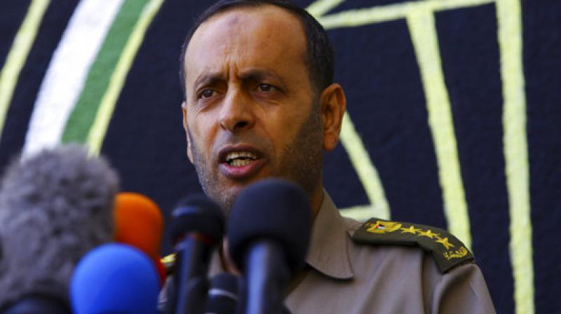 Nasser Suliman, head of military judiciary, announces during a press conference that the military court sentenced to death three men convicted of killing Mazen Faqha, a top militant commander in March, at Hamas military judiciary building in Gaza City. (Photo: AP)