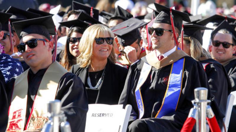Judy OConnor, center, sits with her son, MBA graduate Marty OConnor, during commencement at Chapman University in Orange, Calif. (Photo: AP)