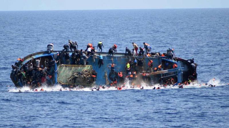 Italy coast guard says at least 20 dead in migrant capsizing