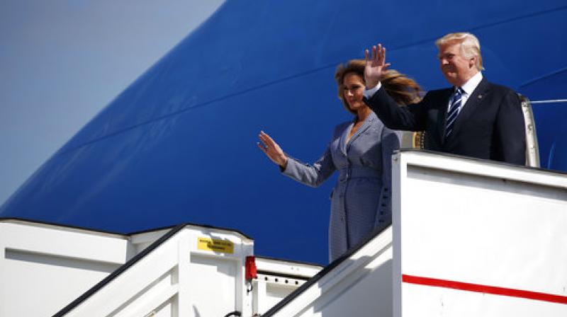 President Donald Trump and first lady Melania Trump wave upon their arrival at Brussels International Airport, Wednesday, May, in Brussels. (Photo: AP)