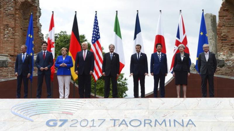 G7 leaders, from left, European Council President Donald Tusk, Canadian Prime Minister Justin Trudeau, German Chancellor Angela Merkel, U.S. President Donald Trump, Italian Prime Minister Paolo Gentiloni, French President Emmanuel Macron, Japanese Prime Minister Shinzo Abe, British Prime Minister Theresa May, and European Commission President Jean-Claude Juncker, pose for a family photo at the Ancient Greek Theater of Taormina. (Photo: AP)