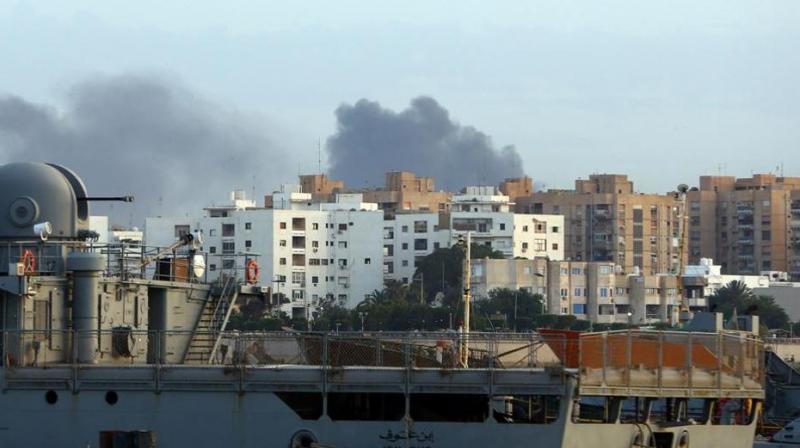 Smoke rises in the centre of the Libyan capital of Tripoli after clashes.(Photo: AFP)