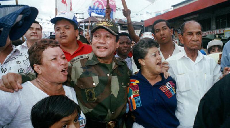 In this May 2, 1989 file photo, Gen. Manuel Antonio Noriega walks with supporters in the Chorrilo neighborhood, where he dedicated a new housing project, in Panama City. (Photo: AP)