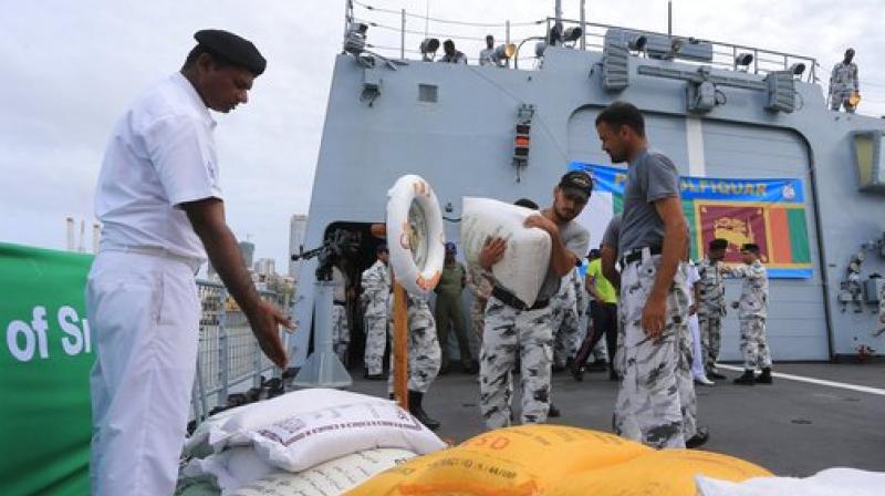 Pakistan Navy soldiers of PNS Zulfiquar unload relief materials to be used in the flood affected areas, Colombo, Sri Lanka, Tuesday, May 30, 2017. Mudslides have become common during Sri Lankas summer monsoon season as forests across the tropical Indian Ocean island nation have been cleared for export crops such as tea and rubber. (Photo: AP)