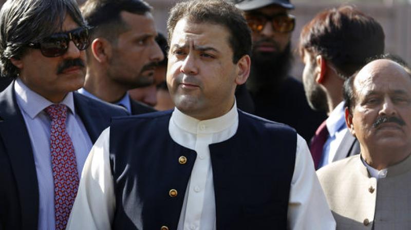 Hussain Nawaz, son of Pakistans Prime Minister Nawaz Sharif, talks to reporters outside the premises of the Joint Investigation Team, in Islamabad, Pakistan. (Photo: AP)
