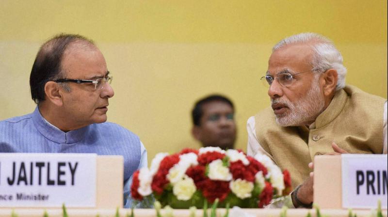 Prime Minister Narendra Modi will interact with Finance Minister Arun Jaitley and other top officials on Tuesday to take stock of Indias economic situation. Photo: PTI