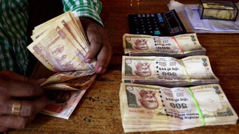 The Income Tax Department will soon issue notices to those who have deposited \suspicious\ amounts of money in banks post-demonetisation and have not responded to taxmans preliminary communication. (Photo: PTI)