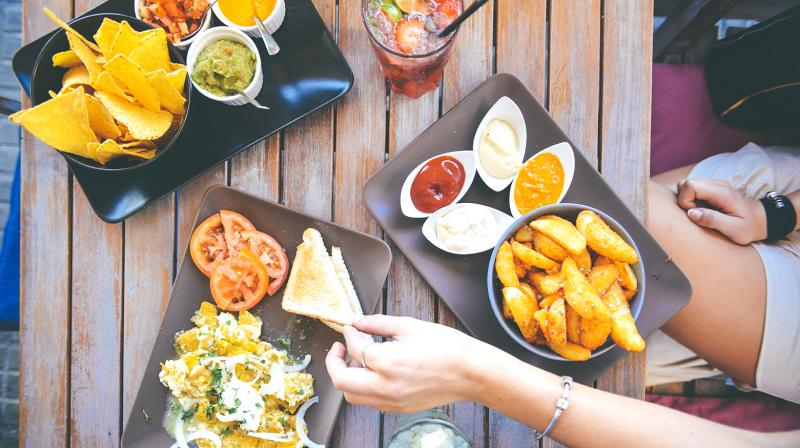 Eating out and mass consumption products have become cheaper as the lower GST rates on over 200 items come into effect from Wednesday. (Photo: Pexel)