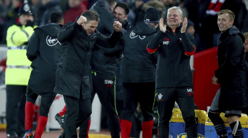 Southampton manager Claude Puel (L) celebrates after Shane Longs goal. (Photo: AP)