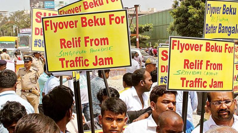 Members of the Steel Bridge Beku Brigade on Saturday will hold a walkathon from Mekhri Circle to Palace Grounds and submit a memorandum to Governor Vajubhai Vala seeking his intervention to get the steel flyover project going.