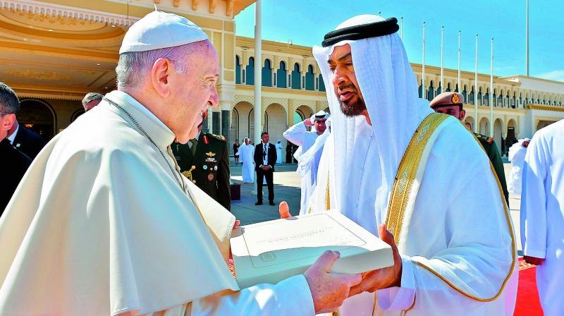 Pope Francis gifts Abu Dhabis Crown Prince Mohammed bin Zayed al-Nahyan a copy of Human Fraternity document before leaving on Tuesday. (Photo: AFP)