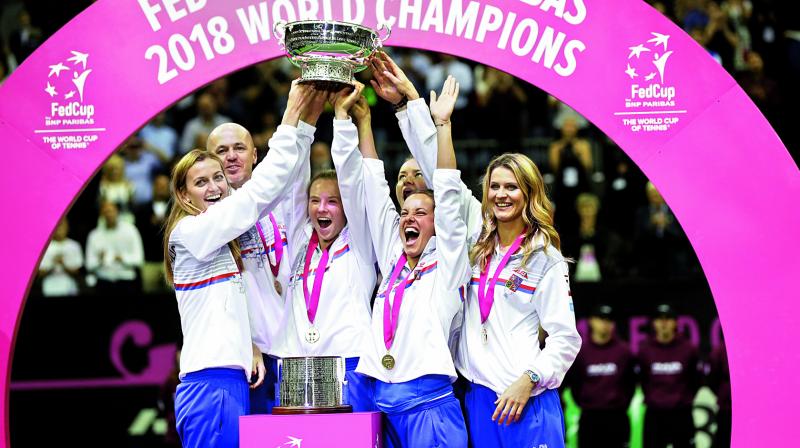 Katerina Siniakova (centre) of Czech Republic and her teammates lift the trophy after winning the Fed Cup Final against United States in Prague, Czech Republic, on Sunday. Czech Republic won 3-0. (Photo:AP)