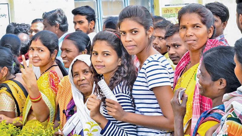People wait in queues to cast their votes at a polling station at Mangnar during the first phase of Assembly elections in Chhattisgarh, in Naxal-affected Bastar district,  Monday.(Photo: PTI)