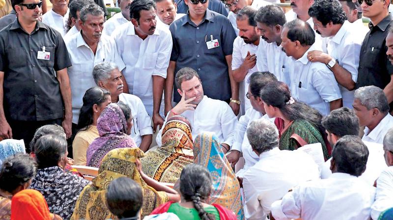 Congress president-elect Rahul Gandhi meets with the families of fishermen affected by Cyclone Ockhi in Kanyakumari on Thursday. (Photo: AP)
