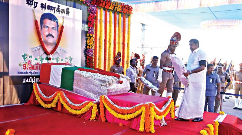 Chief Minister Edappadi K. Palaniswami pays tribute to the slain police inspector S. Periyapandi at Chennai airport, on Thursday (Photo: DC)